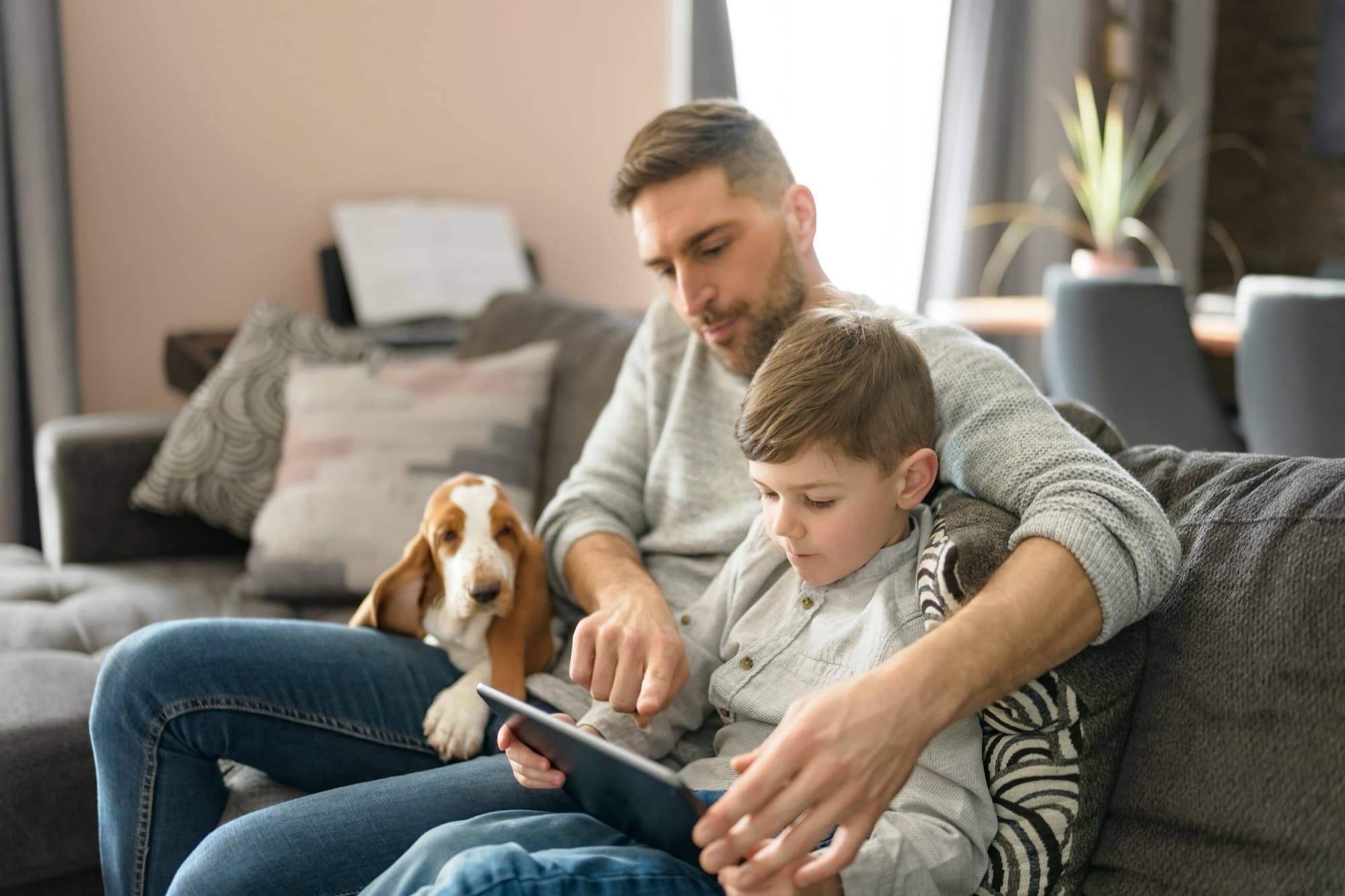 Happy couple looking out of the window